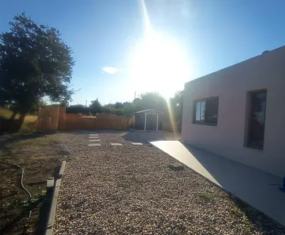 a building with the sun shining behind it at Imagio 22 in Sálakos
