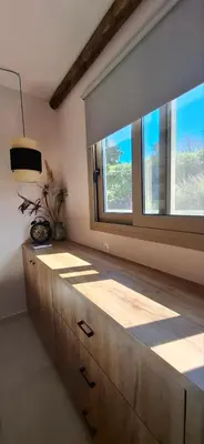 a room with a large window and a dresser at Imagio 22 in Sálakos