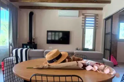 a hat sitting on a table in a living room at Imagio 22 in Sálakos
