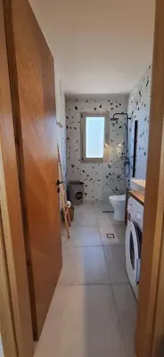 a bathroom with a toilet and a sink at Imagio 22 in Sálakos