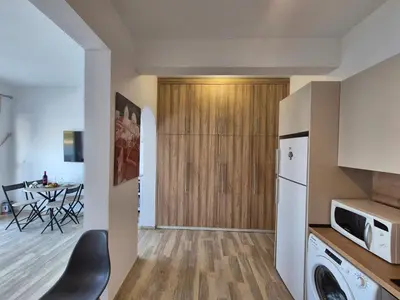 a kitchen and living room with a washer and dryer at Anastasia Beach House Haraki in Rhodes Town