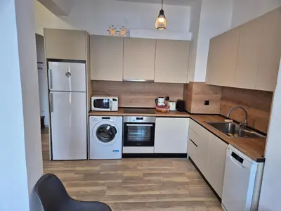 a kitchen with a refrigerator and a sink and a dishwasher at Anastasia Beach House Haraki in Rhodes Town