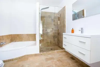 a bathroom with a tub and a sink and a shower at Villa Franky Ladikoheizbarer Pool in Faliraki