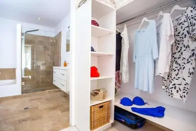a bathroom with a walk in closet and a shower at Villa Franky Ladikoheizbarer Pool in Faliraki
