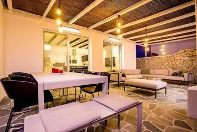 a living room with a table and chairs at Villa Franky Ladikoheizbarer Pool in Faliraki
