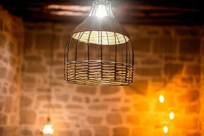 a bird cage hanging from a ceiling at Manolis and Anna's House in Malona Village