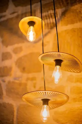 a group of lights hanging from a ceiling at Manolis and Anna's House in Malona Village