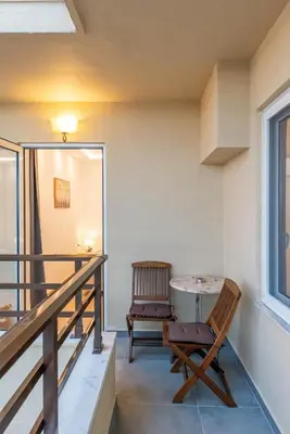 a room with a table and a chair at Hella apartment in Rhodes Town