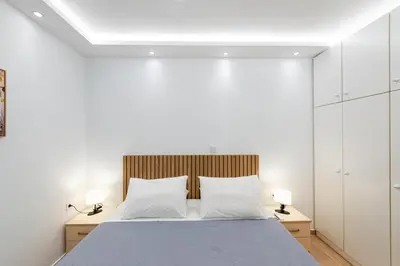 a bedroom with a bed with two white pillows at Hella apartment in Rhodes Town