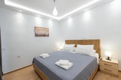 a bedroom with a bed with two towels on it at Hella apartment in Rhodes Town