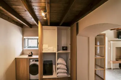 a laundry room with a washer and dryer at Rizes Traditional House in Phanaes