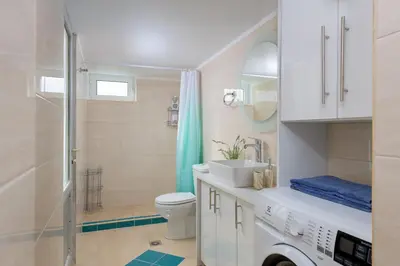 a bathroom with a toilet and a sink and a shower at Rhodes Heaven Jasmine in Malona Village