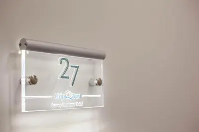 a clock on a wall with the number fourteen at Lido Star in Faliraki