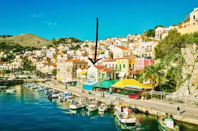 a group of boats are docked in a harbor at Nikolakis, Seafront- Harbor view in Symi