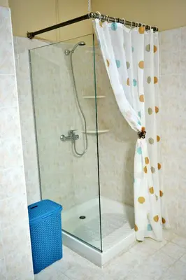 a shower with a glass shower curtain in a bathroom at Villa with private pool Zambakas in Kalithies