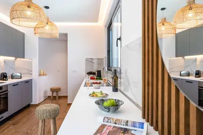 a kitchen with a counter with a bowl of fruit on it at Villa Margarita Gennadi in Gennadi
