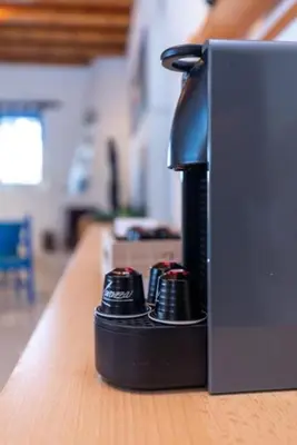 a black controller sitting on top of a table at Sylvia's Beach House in Stegna in Archangelos