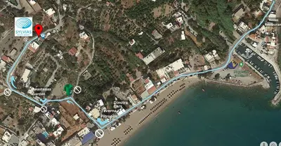 a map of a beach with a red heart at Sylvia's Beach House in Stegna in Archangelos