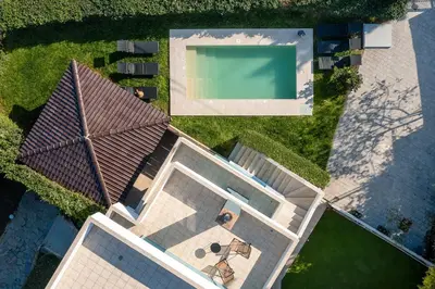 an overhead view of a house with a swimming pool at Villa Annatoli in Koskinou