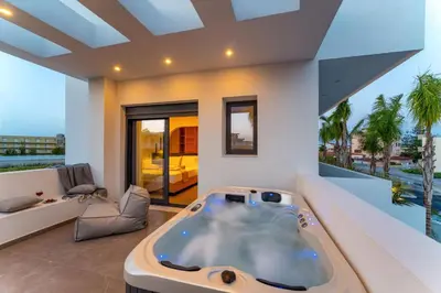a large bath tub in a living room at Villa Palmeras Evelia by Villa Plus in Ialyssos