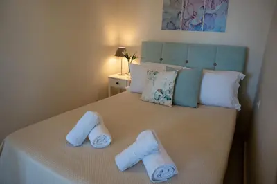 a bedroom with a bed with towels on it at 
