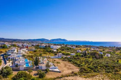 an aerial view of a town with the ocean in the background at Villa Levanta in Gennadi