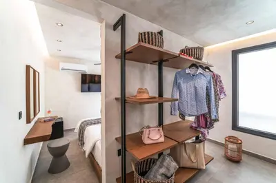 a room with shelves and a bedroom with a bed at Villa Helios in Kiotari