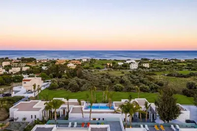 an aerial view of a resort with the ocean at Villa Paparouna in Gennadi