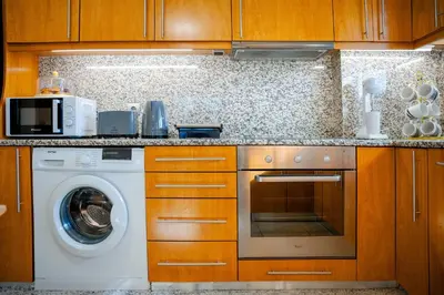 a kitchen with a washer and a washing machine at Katerina Apartment in Afantou