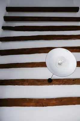 a white ceiling with a light on it at 1919's Studio in Asklipiḯon