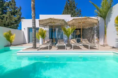 a villa with a swimming pool and a house at Villa Elia Gennadi in Gennadi