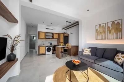 a living room with a couch and a table at Villa Kiotari Sky in Kiotari