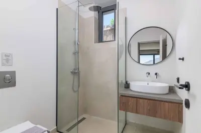 a bathroom with a sink and a mirror at Massari Hills Villa 8 in Malona Village