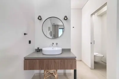 a bathroom with a sink and a mirror at Massari Hills Villa 8 in Malona Village