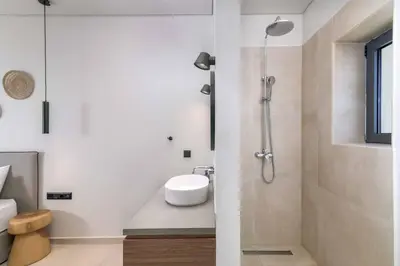 a bathroom with a shower and a sink at Massari Hills Villa 8 in Malona Village
