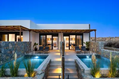 a villa with a swimming pool and a house at Villa Kiotari Star in Kiotari