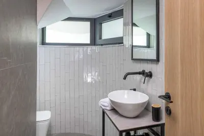 a bathroom with a sink and a mirror at Villa Evelia in Ialyssos