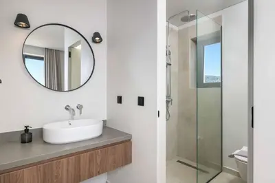 a bathroom with a sink and a mirror at Massari Hills Villa 9 in Malona Village