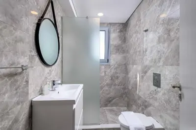a bathroom with a sink and a mirror at Villa Pefko in Gennadi