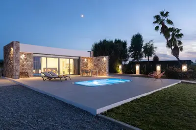 a backyard with a swimming pool and a house at KYRA beachfront house in Theologos Rhodes in Theologos