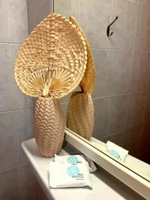 two baskets sitting on a shelf in a bathroom at Villa Paradisos Archangelos in Archangelos