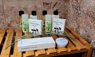 a table with four bottles of essential oils on it at Casa Medievale in Rhodes Town