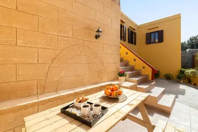 a patio with a table with fruit on it at Casa Medievale in Rhodes Town