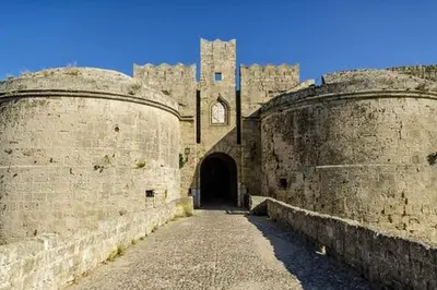 an old building with a castle in the background at Casa Medievale in Rhodes Town
