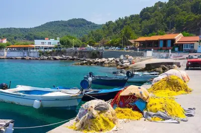 a group of boats are docked in the water at Maison authentique avec grande terrasse in Kritinía