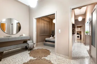 a bathroom with a sink and a mirror at Lefka Home in Rhodes Town