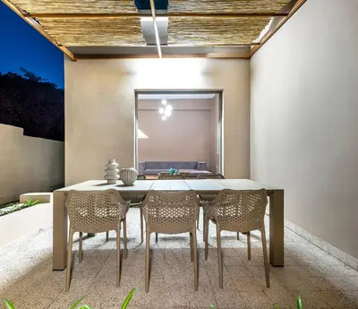 a dining room with a table and chairs at Lefka Home in Rhodes Town