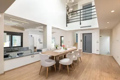 a kitchen and dining room with a table and chairs at Elias' Rest Villa in Pastida