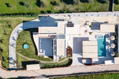 an overhead view of a white house with a pool at Elias' Rest Villa in Pastida