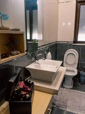 a bathroom with a sink and a toilet at Papa’s house in Kalithies
